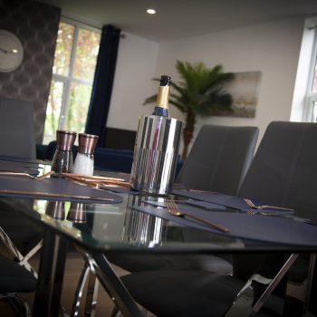 Dining room image with bottle of prosecco